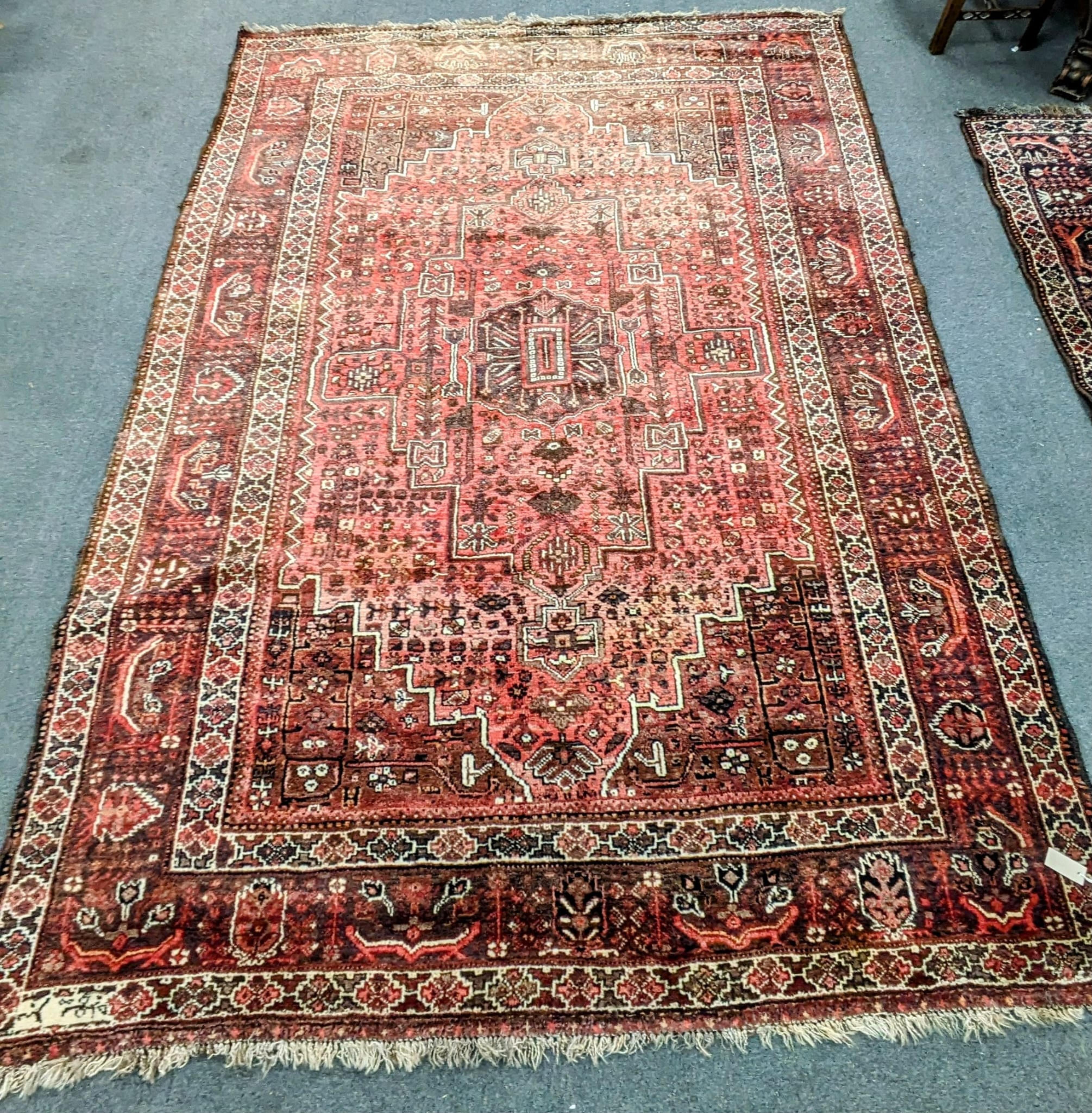 A Persian Shiraz carpet, 300 x 220cm